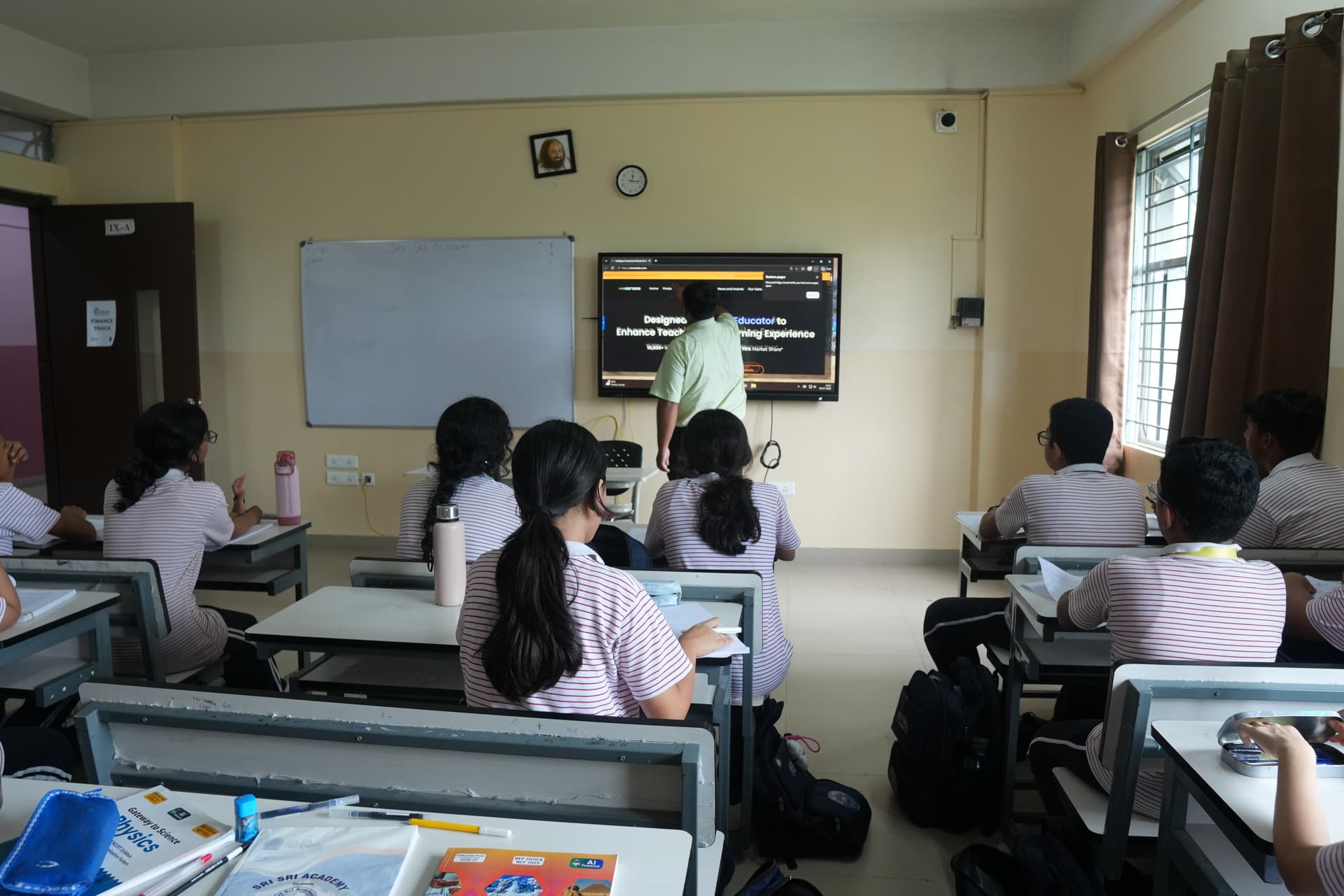 A technology-enabled classroom with a wall-mounted LED screen