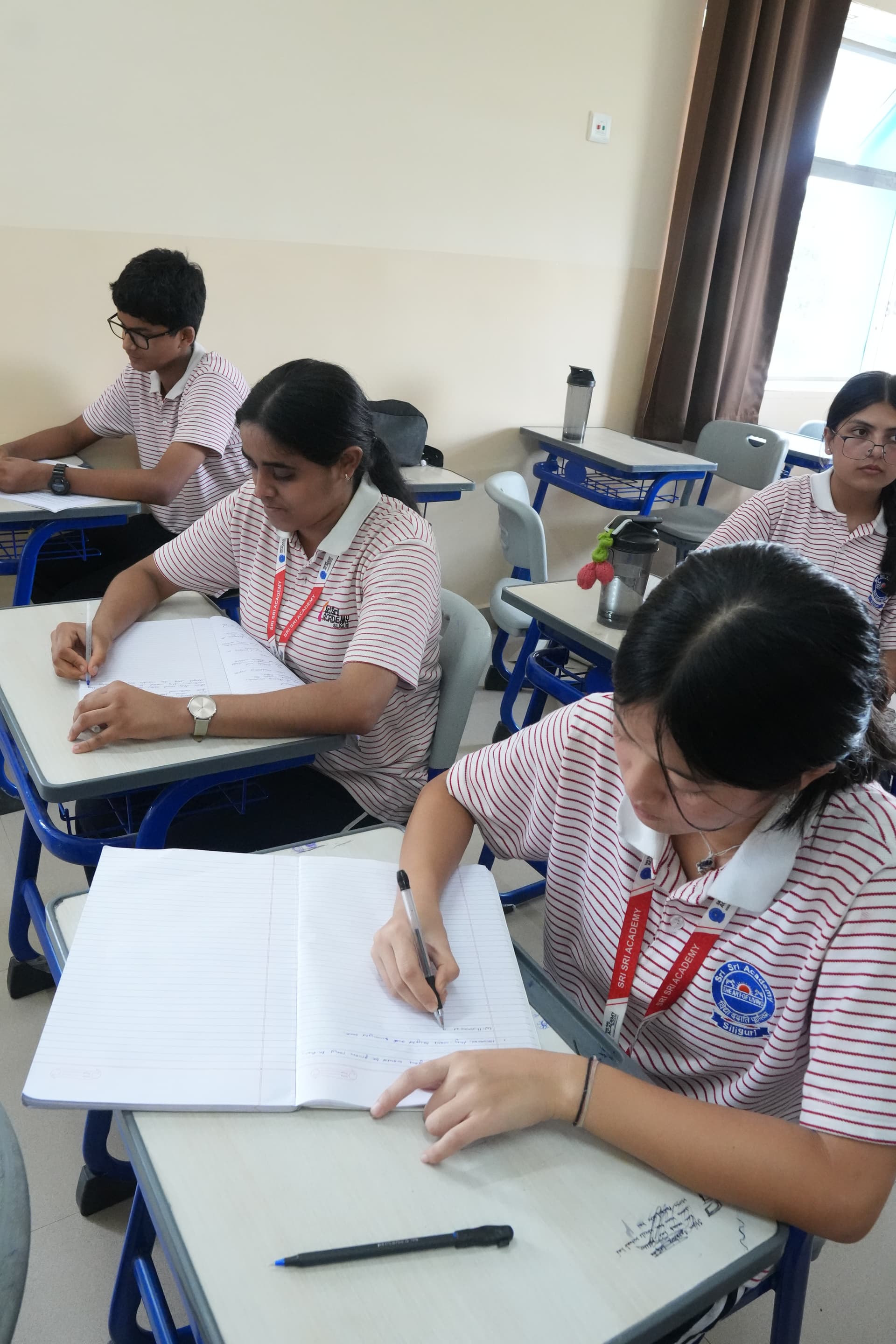 Students listening during a lesson at Sri Sri Academy