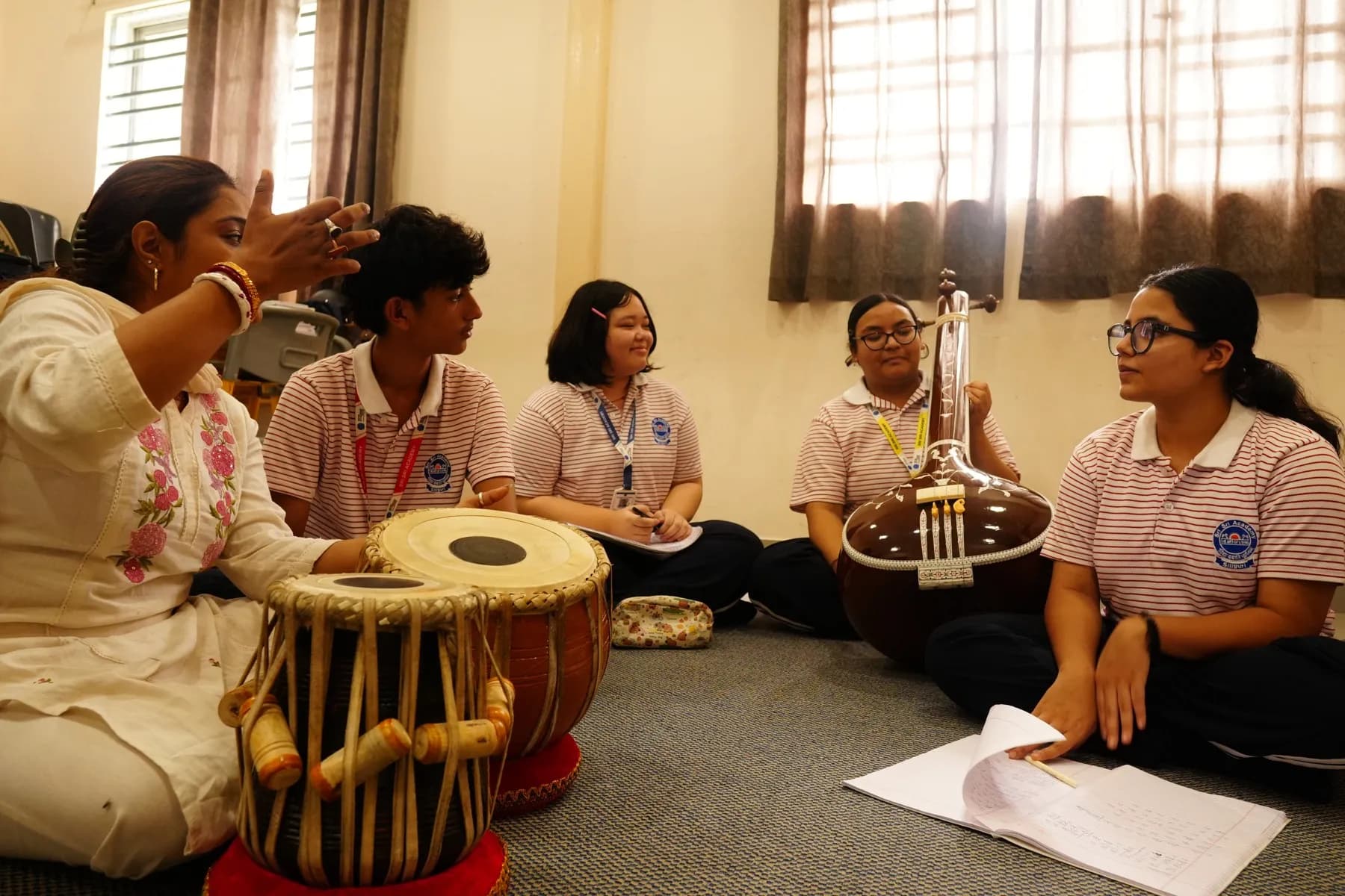 A music lesson with tabla and tanpura at Sri Sri Academy